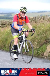 Alex Ralton cycling at Ironman UK