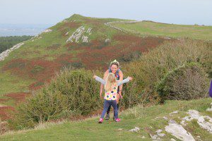 Michelle Maxwell with daughter on cliff tops Gower 50 Ultra finish